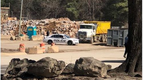 Police said the driver shot outside a Doraville recycling plant last week remains in the hospital in serious condition.