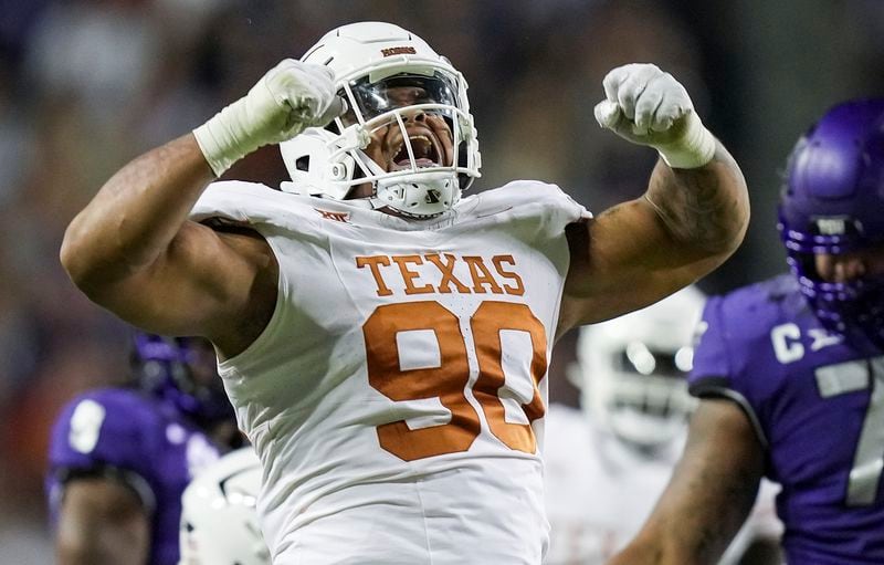 FILE - Texas defensive lineman Byron Murphy II (90) celebrates after a sack against TCU quarterback Josh Hoover in the first half of an NCAA college football game, Saturday, Nov. 11, 2023, in Fort Worth, Texas. Murphy has been mentioned as a possible NFL Draft first round pick by the Cincinnati Bengals. (Ricardo B. Brazziell/Austin American-Statesman via AP, File)