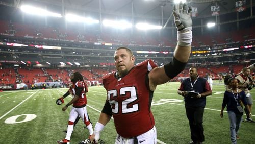 Former Falcons center Todd McClure waves to the home crowd during his final of 14 seasons with the team. JASON GETZ / JGETZ@AJC.COM
