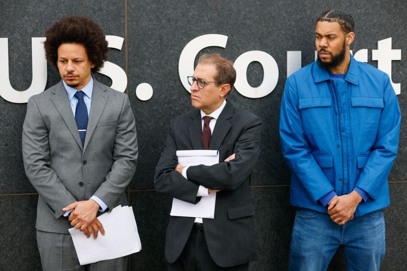 (L-R) Eric André, Barry Friedman, and Clayton English stand in front of the Richard B. Russell federal courthouse during a press conference in Atlanta on Tuesday, October 11, 2022. André and English filed a lawsuit alleging they were racially profiled and searched at Hartsfield-Jackson. (Arvin Temkar / arvin.temkar@ajc.com)