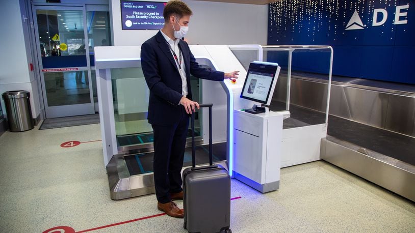 Delta's managing Director of Airport Experience, Greg Forbes, demonstrates self check-in during a tour of Delta's facial recognition system at Hartsfield-Jackson International Airport in Atlanta on Tuesday, Oct. 26, 2021. PHIL SKINNER FOR THE ATLANTA JOURNAL-CONSTITUTION.