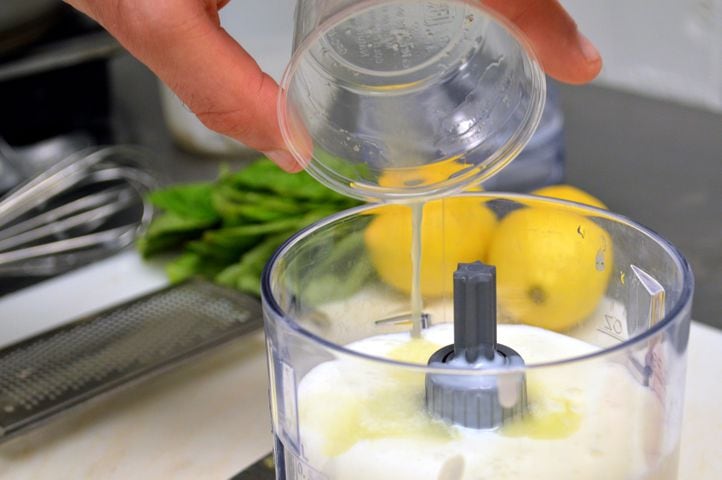 Pour the chilled mixture into a blender and add the juice from two lemons