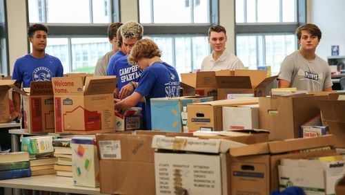 Campbell High School seniors collected about 3,000 books to start two libraries in Africa.