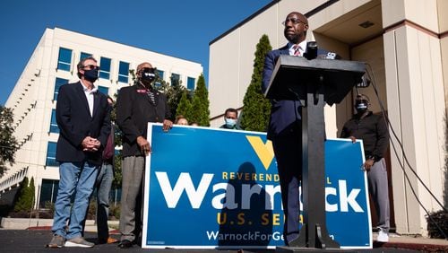 The Rev. Raphael Warnock, who will face Sen. Kelly Loeffler in a runoff election, speaks during a press conference Thursday afternoon outside of the International Brotherhood of Electrical Workers building in Atlanta. Ben Gray for the Atlanta Journal-Constitution