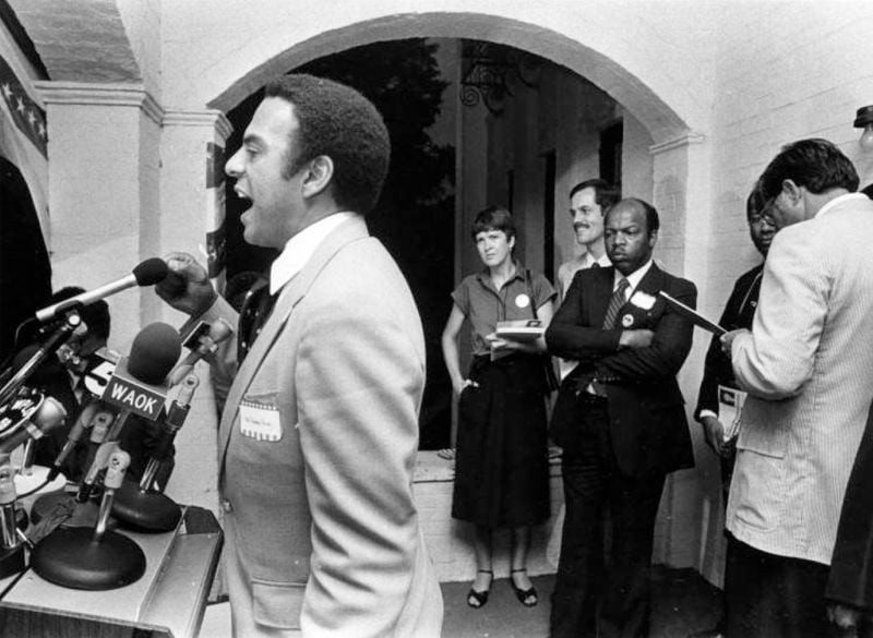 Mayoral candidate Andrew Young speaks during a press conference at the Justice Center with John Lewis on Sept. 15, 1981. Three weeks later, Young and Lewis would be voted in as mayor and councilman, respectively. During the fight over the “Great Park plan” that next year, Lewis faced criticism for not being loyal to Mayor Young. (Andy Sharp / AJC Archive at GSU Library AJCP549-016a)