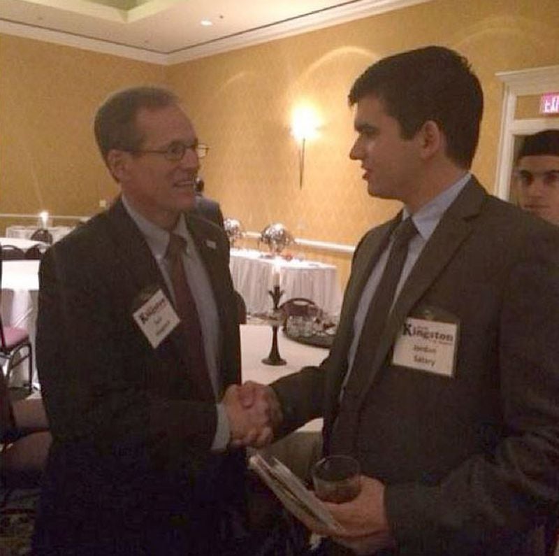 Jordan Satary, Khalid Satary’s son, greets Rep. Jack Kingston at a Chateau Elan fundraiser in December 2013. Jordan Satary was listed as CEO of a company whose employees contributed to Kingston’s U.S. Senate campaign. Many of Satary’s financial holdings are now in his son’s name.