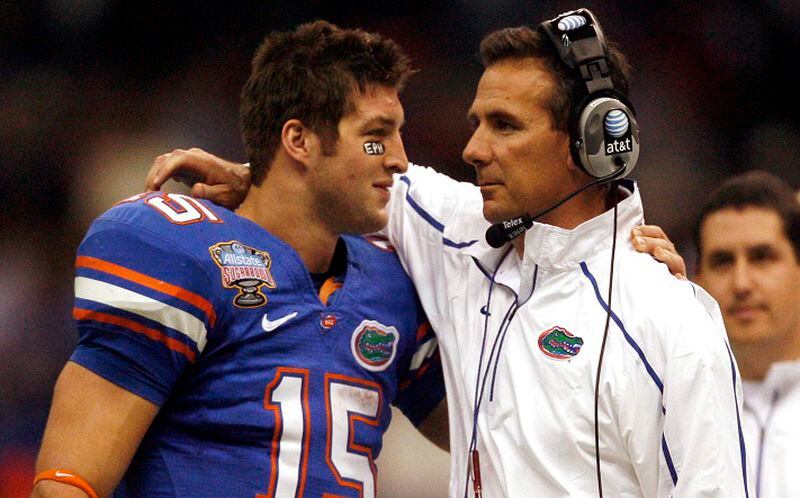 Florida coach Urban Meyer and quarterback Tim Tebow share a moment on the sidelines during the fourth quarter against Cincinnati in the Sugar Bowl on Jan. 1, 2010, in New Orleans. (Gary W. Green/Orlando Sentinel)