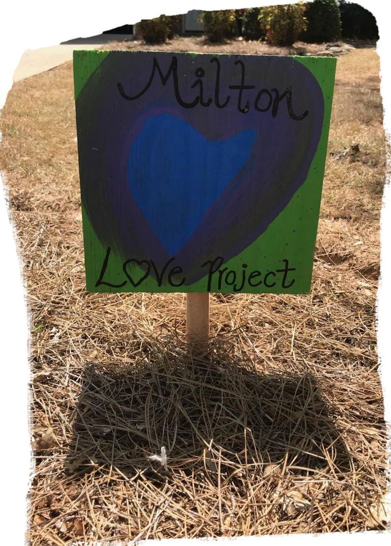 This placard is one of several acts of kindness Hilary Karp has received since a group of teens vandalized the driveway outside her home. The placard was left by the Milton Love Project, a grass-roots, citizen-led initiative spreading love and support in metro Atlanta. CONTRIBUTED