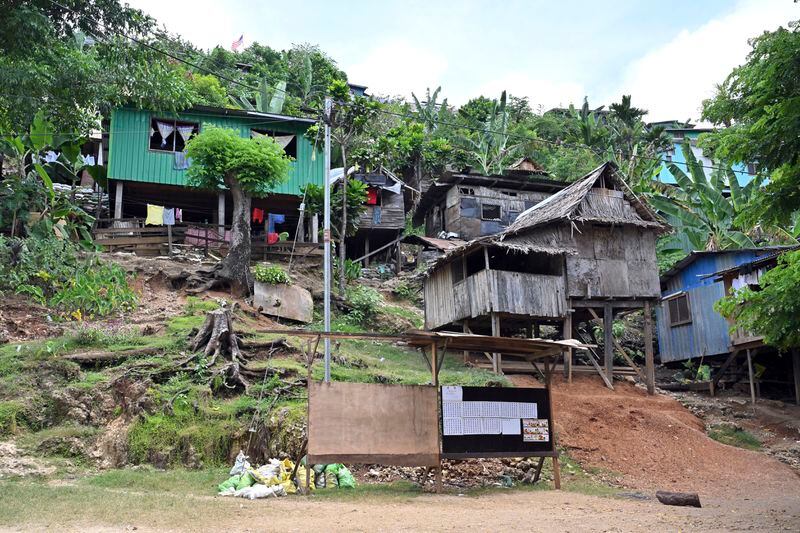 Dwellings are perched at the informal settlement of Koa Hill in Honiara, Solomon Islands, Sunday, April 14, 2024. The country in which China has gained most influence in the South Pacific, Solomon Islands, goes to the polls on Wednesday in an election that could shape the region's future. (Mick Tsikas/AAP Image via AP)