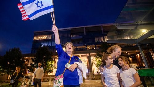 Thousands of Israel supporters, including Rachel Domba, left, and Shiri Tzuk, right, with her children Naama Tzuk and Nora Tzuk, gather inside and outside of City Springs in Sandy Springs on Tuesday, Oct 10, 2023 for a rally for Israel. (Jenni Girtman for The Atlanta Journal-Constitution)
