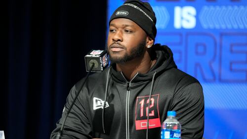 Michigan defensive lineman Chris Hinton speaks during a press conference at the NFL football scouting combine in Indianapolis, Friday, March 4, 2022. (AP Photo/AJ Mast)