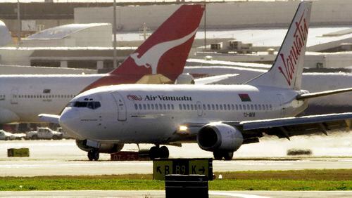 An Air Vanuatu plane makes an emergency landing at Sydney Airport, August 2, 2001, after suspected under carriage damage. Air Vanuatu announced on Thursday, May 9, 2024, the airline had cancelled international flights for four days and was considering bankruptcy protection for the South Pacific state-owned carrier. (Dean Lewins/AAP Image via AP)