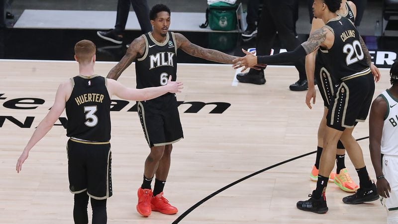 Lou Williams (center) shined in his first career playoff start Tuesday in leading the Hawks past the Bucks.