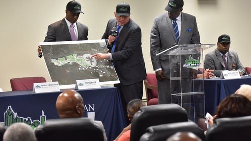 Craig Delasin (center), CEO of Urban Retail Properties, explains as Patrick Henderson (left), CEO of Atlanta Sports Connection, and Zeric Foster, COO of Atlanta Sports Connection, stand next him during a press conference on Wednesday, May 17, 2017. Developers and tourism officials revealed plans for medical facilities and retail at Atlanta Sports City. HYOSUB SHIN / HSHIN@AJC.COM