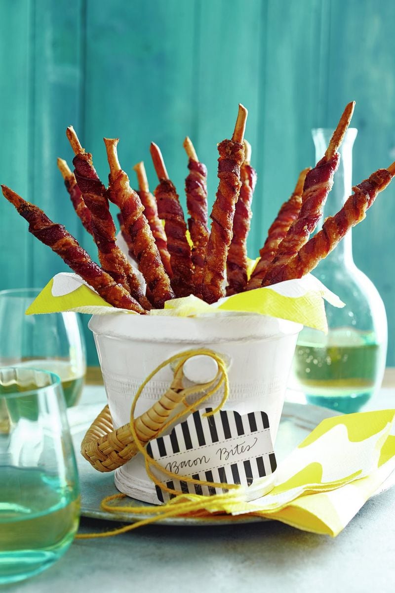 Bacon Bites — bacon slices rolled around breadsticks and coated in brown sugar — are perfect for cocktail parties, according to entertaining guru Elizabeth Heiskell, author of “What Can I Bring? Southern Food for Any Occasion Life Serves Up.” CONTRIBUTED BY PADEN REICH
