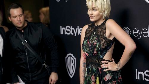 FILE - In this Jan. 8, 2017, file photo, Paris Jackson arrives at the InStyle and Warner Bros. Golden Globes afterparty at the Beverly Hilton Hotel in Beverly Hills, Calif. Jackson said in a Rolling Stone interview published online on Jan. 24, 2017, that she tried to kill herself “multiple times” in the years after her father’s death. (Photo by Matt Sayles/Invision/AP, File)