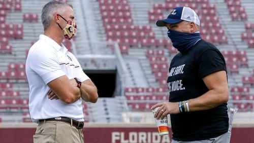 Coach Mike Norvell of Florida State talks with coach Geoff Collins of Georgia Tech before the game at Doak Campbell Stadium on September 12, 2020 in Tallahassee, Florida. (Photo by Don Juan Moore/Character Lines)