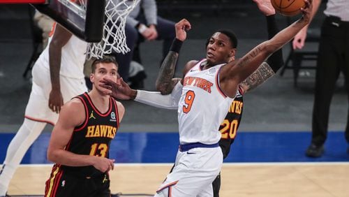 New York Knicks guard RJ Barrett (9) dunks against the Atlanta Hawks during the third quarter of an NBA basketball game Wednesday, April 21, 2021, in New York. (Wendell Cruz/Pool Photo via AP)