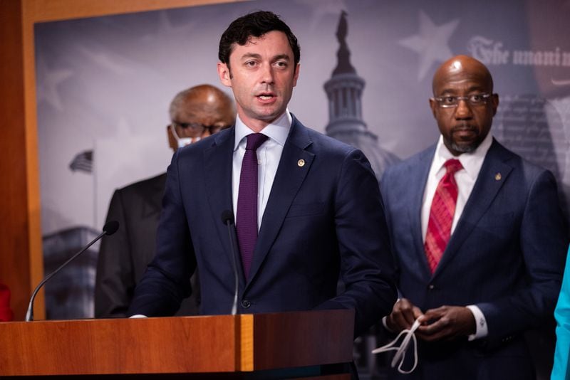Sen. Jon Ossoff, left, and Sen. Raphael Warnock, right, both Georgia Democrats, voted to approve legislation to keep the government funded through Dec. 16. (Nathan Poser for the AJC)