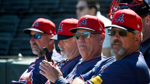 Atlanta Braves’ manager Brian Snitker and coaching staff watch during spring training workouts at CoolToday Park, Thursday, Feb. 22, 2024, in North Port, Florida. (Hyosub Shin / Hyosub.Shin@ajc.com)