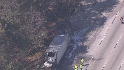 A tractor-trailer carrying paint caught on fire on I-285 in Cobb County.