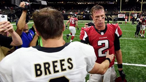 New Orleans Saints quarterback Drew Brees greets Atlanta Falcons quarterback Matt Ryan (2) after an NFL football game in New Orleans, Monday, Sept. 26, 2016. The Falcons won 45-32.