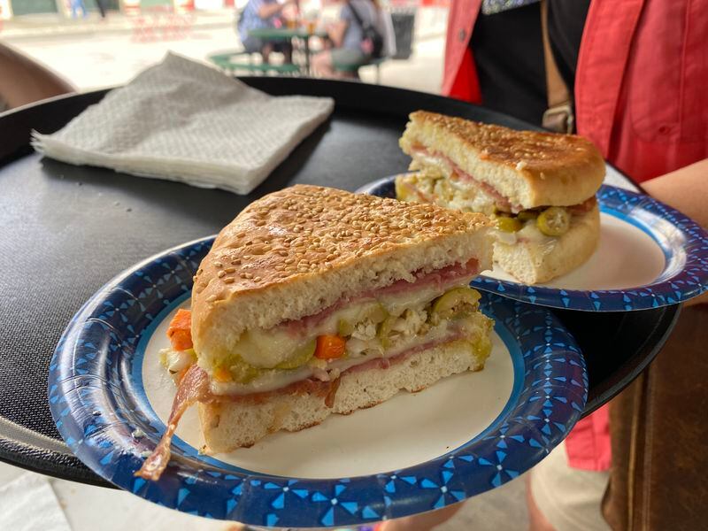 Sample the muffuletta, a sandwich that originated with Italian immigrants, on Destination Kitchen's New Orleans Food Walking Tour. (Courtesy of Destination Kitchen.)