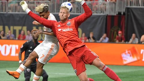 July 21, 2018  - Atlanta United forward Josef Martinez (7) makes a shot on goal past D.C. United goalkeeper David Ousted (1) during the first half in a MLS soccer game at Mercedes-Benz Stadium on Saturday, July 21, 2018. HYOSUB SHIN / HSHIN@AJC.COM