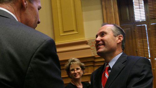 February 2, 2007, ATLANTA -- Sen. Dan Weber, R-Dunwoody, (left) and Lt. Gov. Casey Cagle shake hands after Cagle's charter school system bill, which Weber carried in the Senate, passed the chamber. BEN GRAY / AJC STAFF