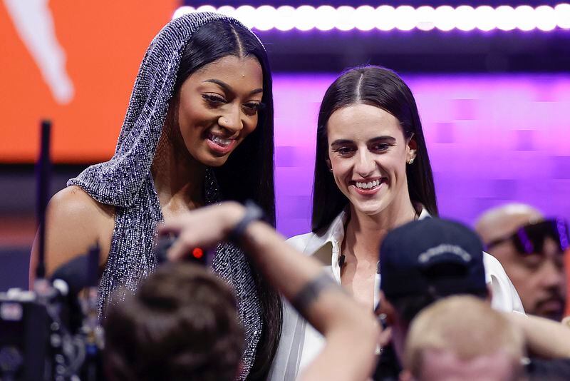 LSU's Angel Reese and Iowa's Caitlyn Clark pose for a photo before the start of the WNBA basketball draft, Monday, April 15, 2024, in New York. (AP Photo/Adam Hunger)