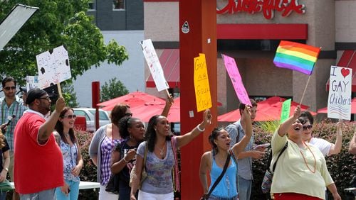 Only three years ago, gay marriage supporters gathered at the Chick-fil-A store in Decatur for a "kiss-in" protest of company president Dan Cathy's stand in opposition to gay marriage. AJC file