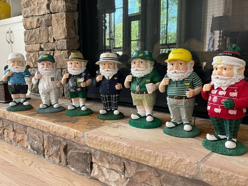 Cynthia Clement displays her gnome collection in the den of her home during Masters' Week.