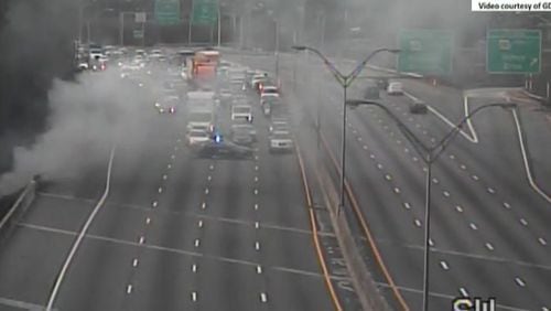A brush fire and a multicar crash closed all lanes of I-20 near H.E. Holmes in Atlanta on Thursday.