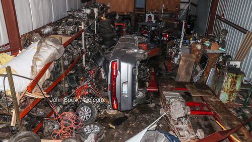 A car ran off Moreland Avenue, flipped and crashed into an auto repair shop Sunday night. The shop's owners said a stretch of Moreland Avenue near Key Road is notorious for street racing.