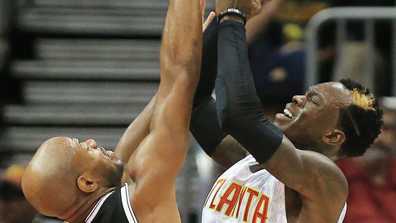 110415 ATLANTA: -- Hawks Dennis Schroder shoots over Nets Jarrett Jack during the second half in a basketball game on Wednesday, Nov. 4, 2015 in Atlanta. The Hawks beat the Nets 101-87 for their fifth straight win. Curtis Compton / ccompton@ajc.com