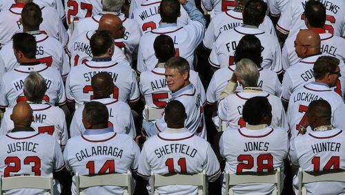 Former Atlanta Brave Dale Murphy (center) looks back at fans during the tribute to manager Bobby Cox in 2010.