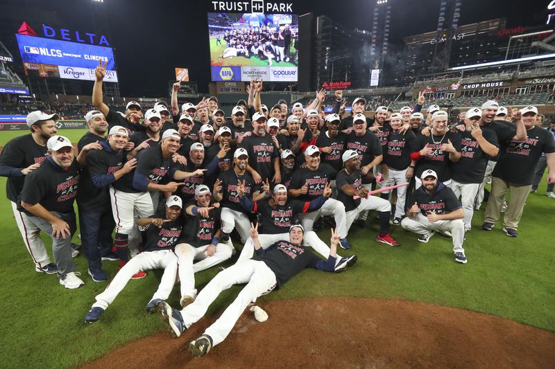 Headed to the NLCS: The Braves celebrate on the turf of Truist Park Tuesday after their 5-4 victory over the Brewers. The win secured the National League Divisional Series matchup for the Braves, and now they will advance to the National League Championship Series. (Curtis Compton/ccompton@ajc.com)