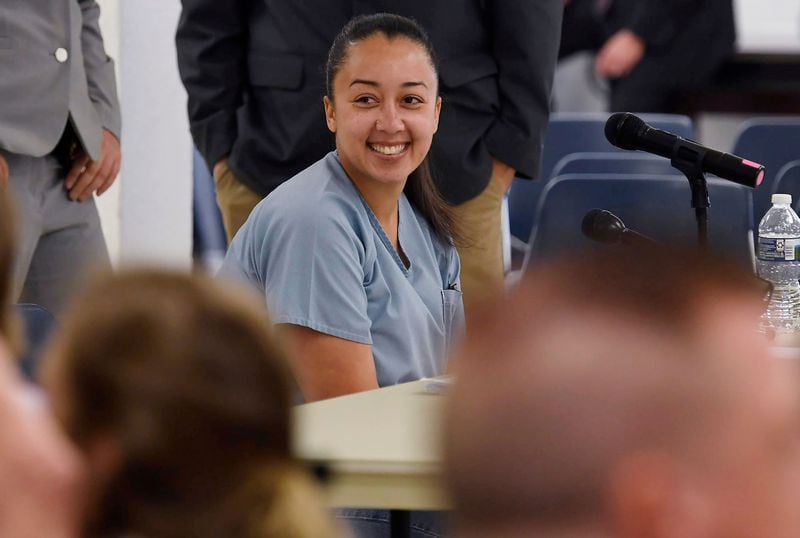 Cyntoia Brown smiles at her friends and family during the break in her clemency hearing Wednesday, May 23, 2018, at Tennessee Prison for Women in Nashville, Tenn. Brown is the Nashville woman sentenced to life in prison at age 16 for the murder of a stranger who picked her up at a fast food restaurant. It is her first bid for freedom before a parole board since the 2004 crime.
