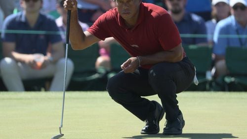 Tiger Woods prepares to putt on 9th green during the final round of the 2024 Masters Tournament at Augusta National Golf Club, Sunday, April 14, 2024, in Augusta, Ga. Jason Getz / Jason.Getz@ajc.com)
