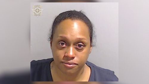 Fulton County detention officer Kawana Jenkins, 36, was arrested and fired after she was accused of having inappropriate behavior with an inmate, authorities said.