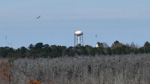 Moody AFB water tower is visible from Grand Bay Boardwalk observation tower near Valdosta. All three of Georgia’s air force bases have recorded high levels of toxic chemicals in groundwater, raising concerns about the impact to the ecologies of the state’s wetlands and the people who recreate there. HYOSUB SHIN / HSHIN@AJC.COM
