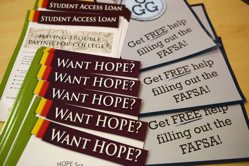 Materials for participants sit on a table at a financial aid workshop.   Half of high school seniors last year didn’t complete the FAFSA form, according to the National College Access Network.