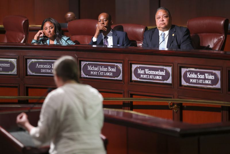 Council members listen to a member of the public as she speaks in opposition to the planned Police Training Center at Atlanta City Hall ahead of the final vote to approve legislation to fund the training center on Monday, June 5, 2023, in Atlanta. (Jason Getz/The Atlanta Journal-Constitution)