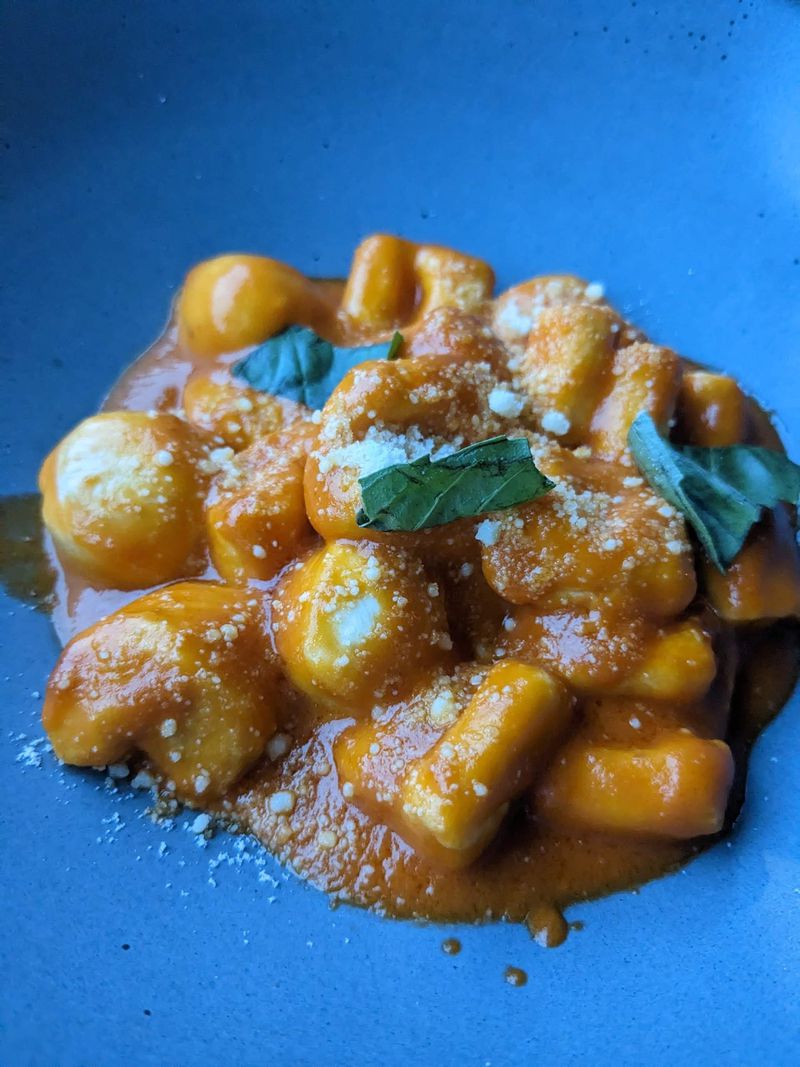 The gnocchi at Alici, tossed in a pomodoro sauce and garnished with basil, is soft as a pillow. Courtesy of Paula Pontes 