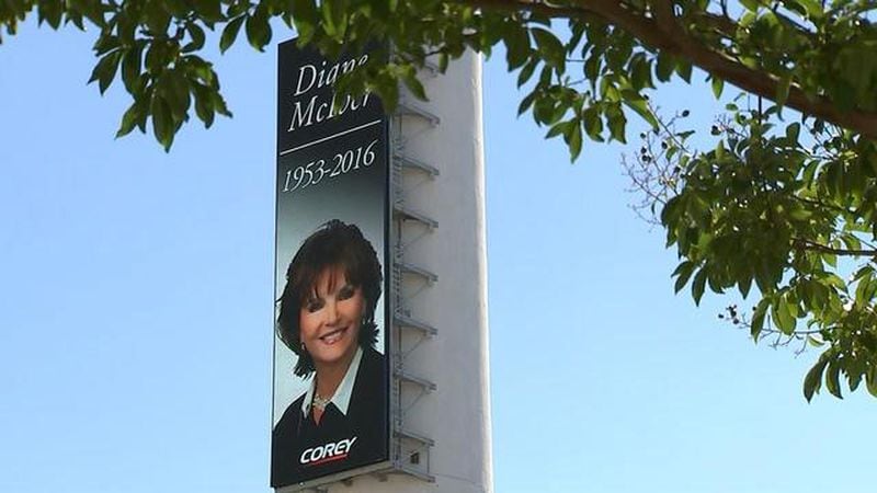 The towering Corey smokestack downtown carried a portrait of Diane McIver, who was president of U.S. Enterprises Inc., parent company of Corey Airport Services. (Photo: Channel 2 Action News)