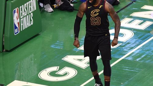Cleveland Cavaliers forward LeBron James (23) reacts after making a basket during the second half in game seven of the Eastern conference finals of the 2018 NBA Playoffs against the Boston Celtics at TD Garden.