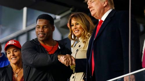 Former President Donald Trump will hold a rally Saturday in Commerce for a slate of Republican candidates he has endorsed, including U.S. Senate hopeful Herschel Walker, left. (Michael Zarrilli/Getty Images/TNS)