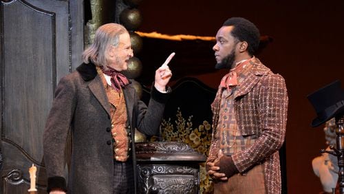 David de Vries as Scrooge and Neal Ghant as Bob Cratchit in “A Christmas Carol” at the Alliance Theatre. CONTRIBUTED BY GREG MOONEY
