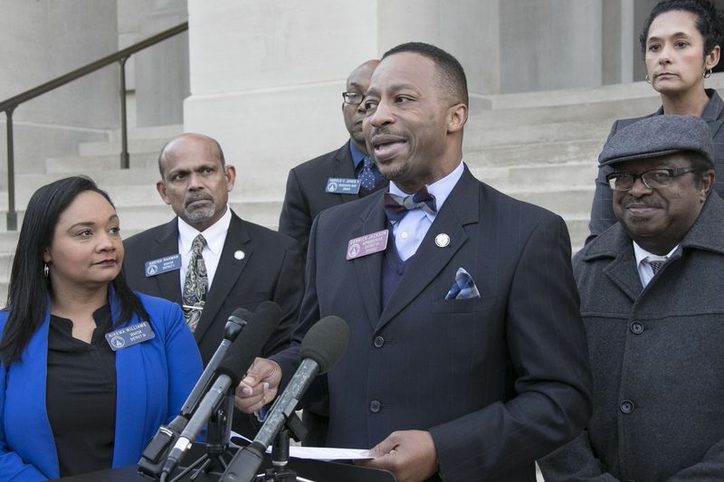 Former state Rep. Derrick Jackson (at the microphone), a Tyrone Democrat, won the endorsements of U.S. Sens. Jon Ossoff and Raphael Warnock for his comeback bid. Jackson is running in the special election in House District 68. (Bob Andres/The Atlanta Journal-Constitution)