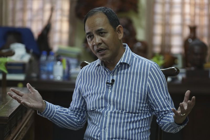 Long Kosal, spokesperson for APSARA, the Cambodian office that oversees the Angkor archaeological site, speaks to The Associated Press at his office in Siem Reap province, Cambodia, on April 1, 2024. Cambodia's program to relocate people living on the famous Angkor archaeological site is drawing international concern over possible human rights abuses, while authorities maintain they're doing nothing more than protecting the UNESCO World Heritage Site from illegal squatters. (AP Photo/Heng Sinith)